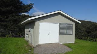 A photograph of the Generator Shed in Sault Island, Ontario (Structure Number 153642)