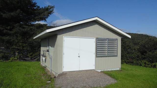 A photograph of the Generator Shed in Sault Island, Ontario (Structure Number 153642)